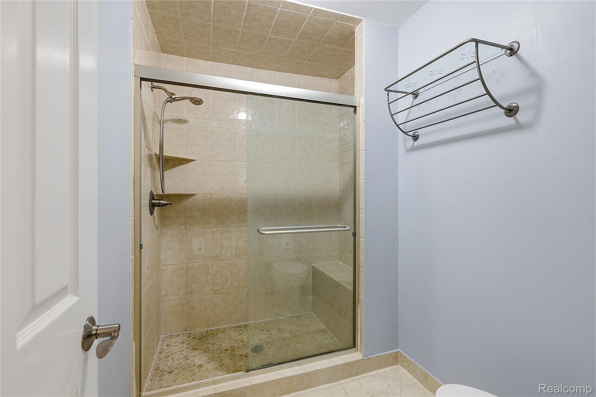 7154 Westchester Road West Bloomfield, MI 48322 - Photo 27 of 38 Bathroom featuring a stall shower and tile patterned flooring