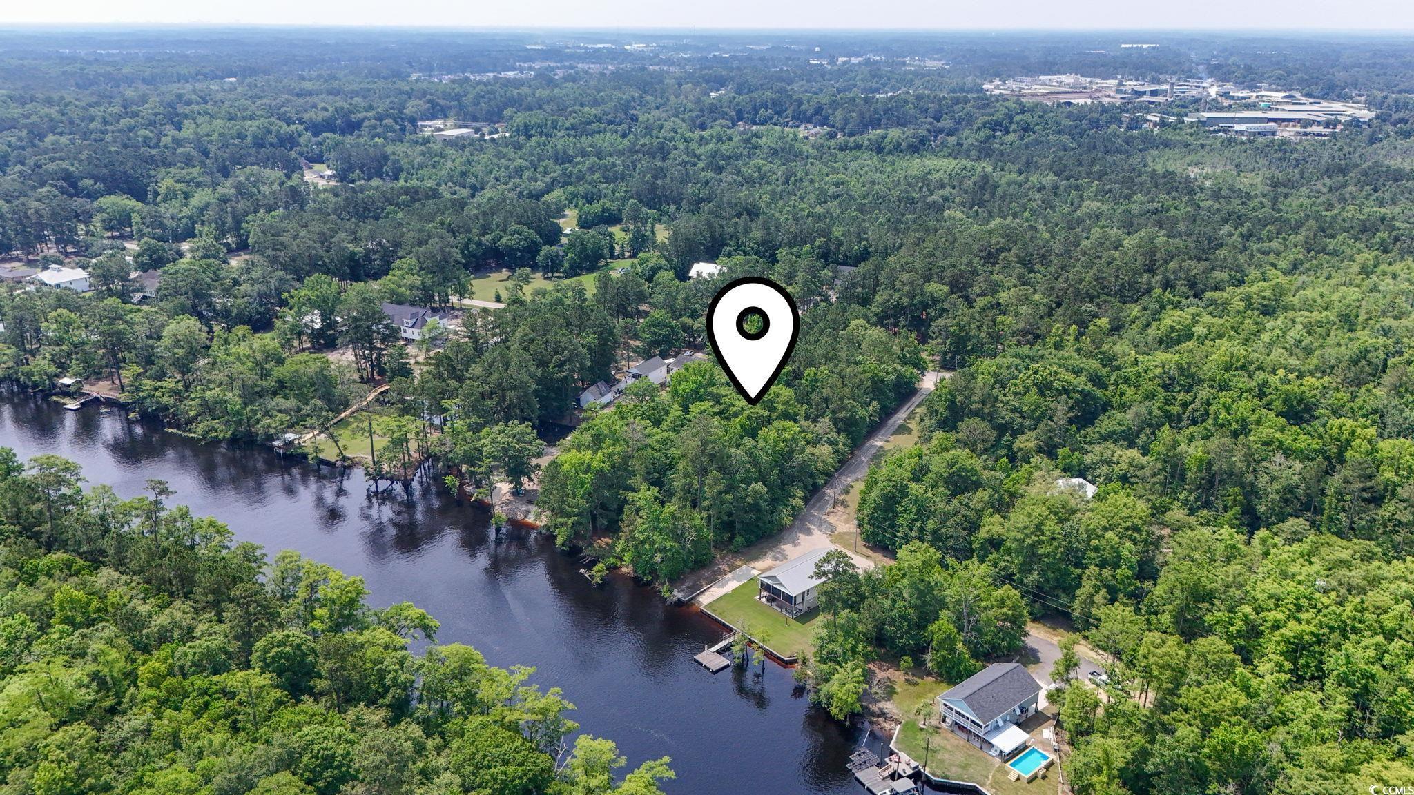 Tbd Riverside Drive Conway, SC 29526 - Photo 2 of 11 Aerial view of a forest and a nearby body of water