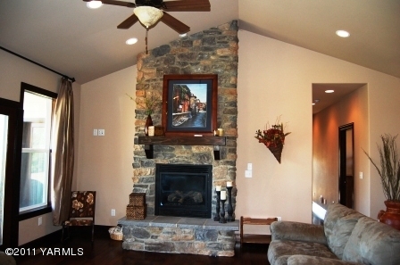 55 North Mize Road Yakima, WA 98908 - Photo 4 of 21 a living room with furniture and a fireplace