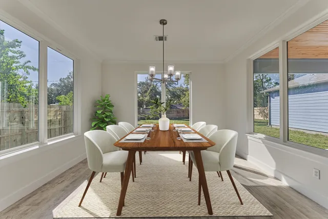 a kitchen with sink stove and white cabinets