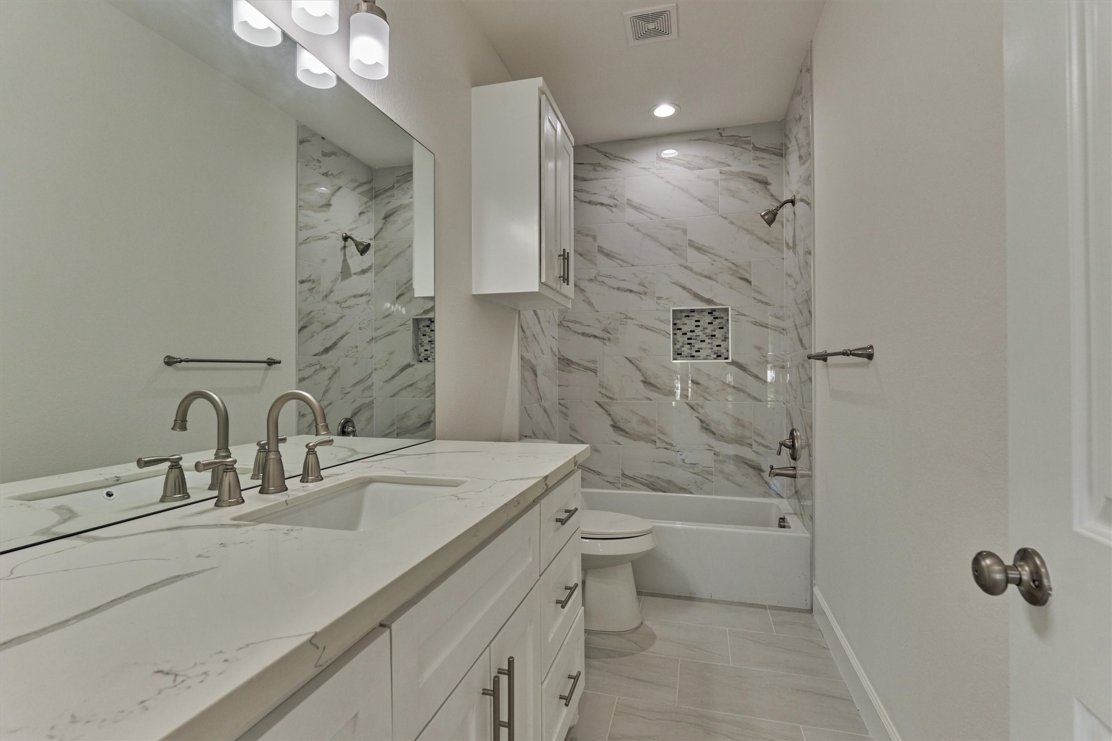1718 Eastvale Drive Spring, TX 77386 - Photo 26 of 40 a bathroom with a double vanity sink mirror double and shower