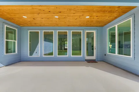 a view of pool with a yard