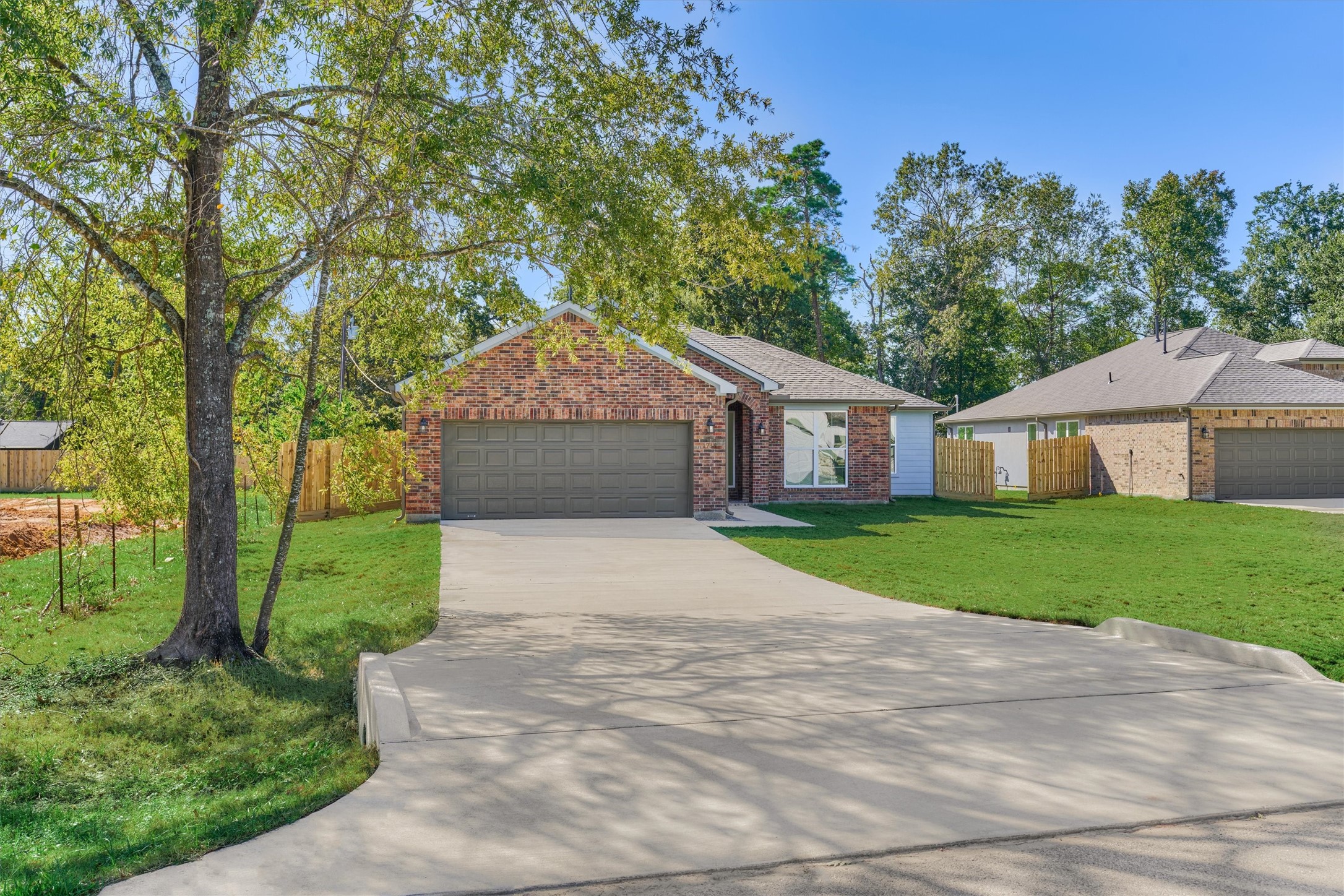 1718 Eastvale Drive Spring, TX 77386 - Photo 37 of 40 a front view of a house with a yard and trees