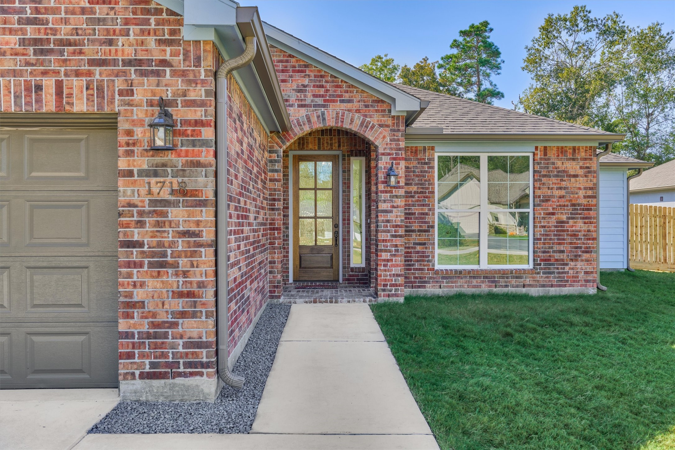 1718 Eastvale Drive Spring, TX 77386 - Photo 4 of 40 a front view of a house with a porch