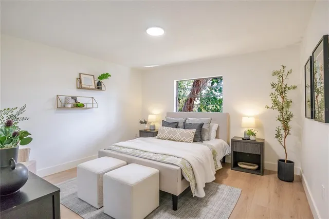 a bedroom with a bed and a table in it