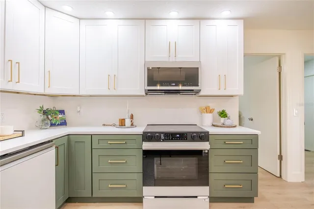 a living room with furniture fireplace and a large window