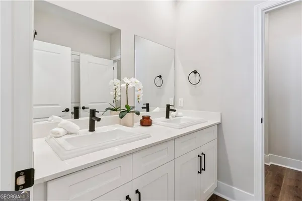 a bathroom with a sink and a mirror