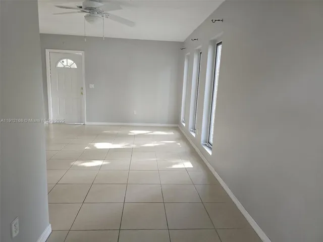 a view of an empty room and window