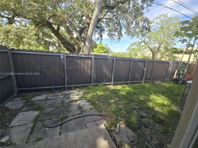a view of backyard with tree