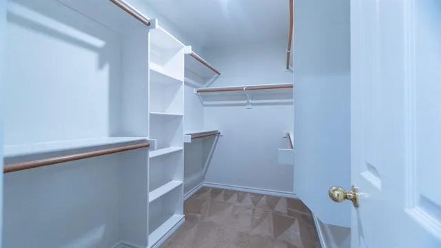 a view of storage and utility room with empty racks