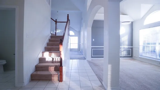 a view of entryway and hall with a front door