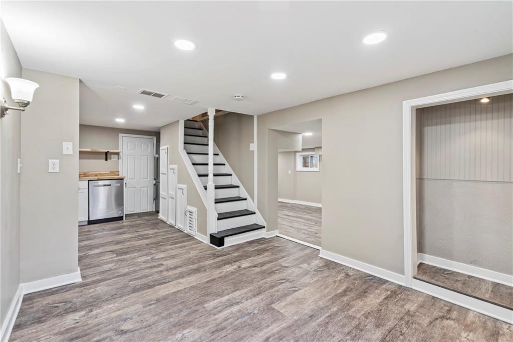 2215 Lehigh Street Pittsburgh, PA 15218 - Photo 17 of 32 an empty room with wooden floor and stairs