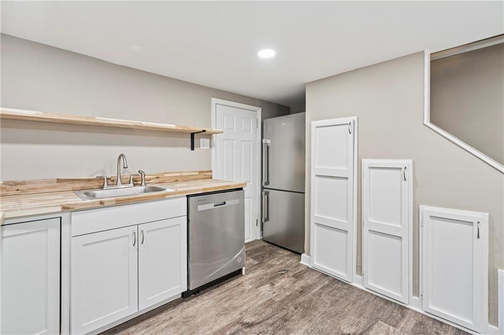 2215 Lehigh Street Pittsburgh, PA 15218 - Photo 18 of 32 a kitchen with a refrigerator sink and cabinets