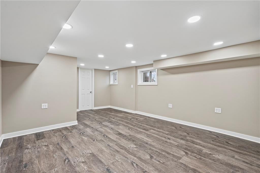 2215 Lehigh Street Pittsburgh, PA 15218 - Photo 26 of 32 a view of an empty room with wooden floor and a window