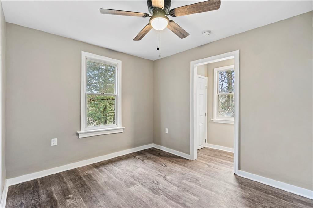 2215 Lehigh Street Pittsburgh, PA 15218 - Photo 10 of 32 a view of an empty room with window and wooden floor