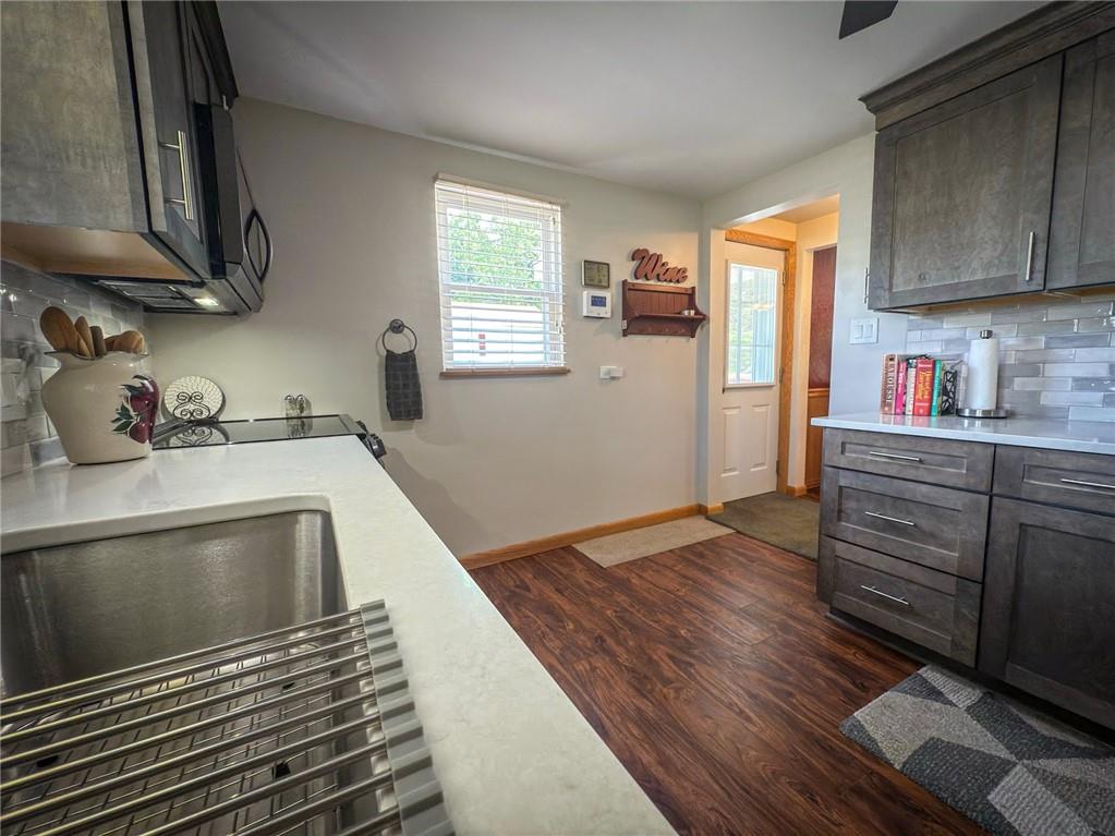 306 Chicora Road Butler, PA 16001 - Photo 12 of 30 a kitchen with wooden floors and a sink