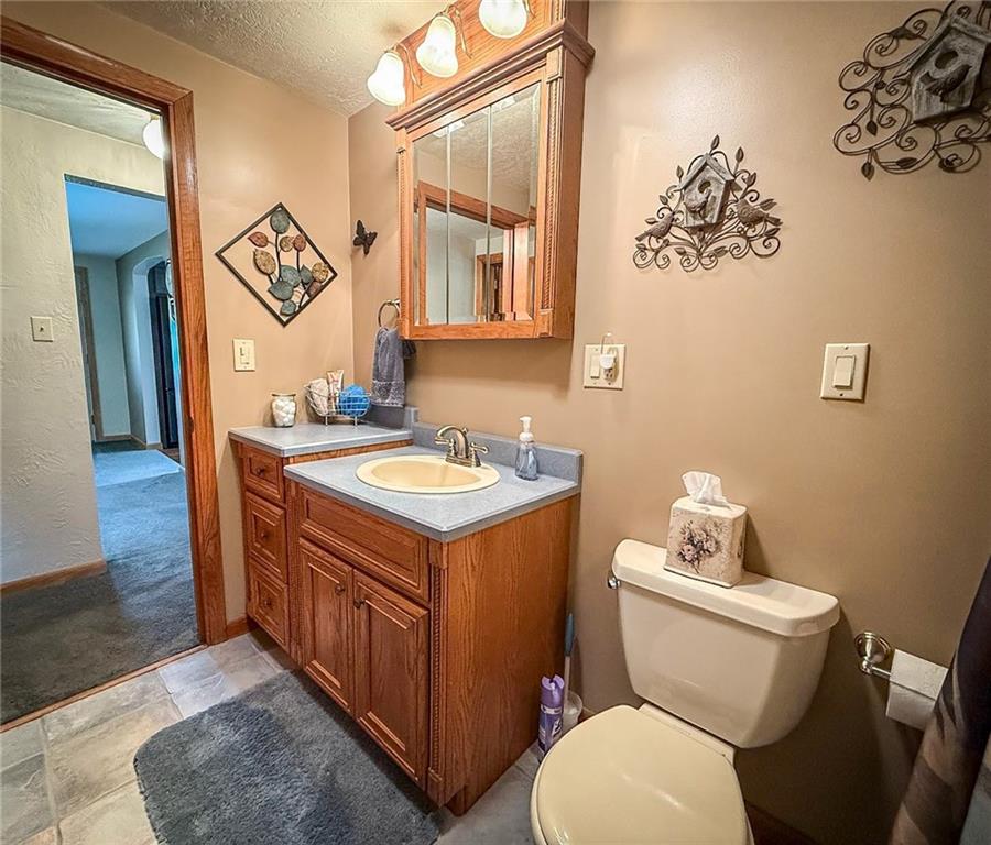 306 Chicora Road Butler, PA 16001 - Photo 16 of 30 a bathroom with a toilet sink and mirror