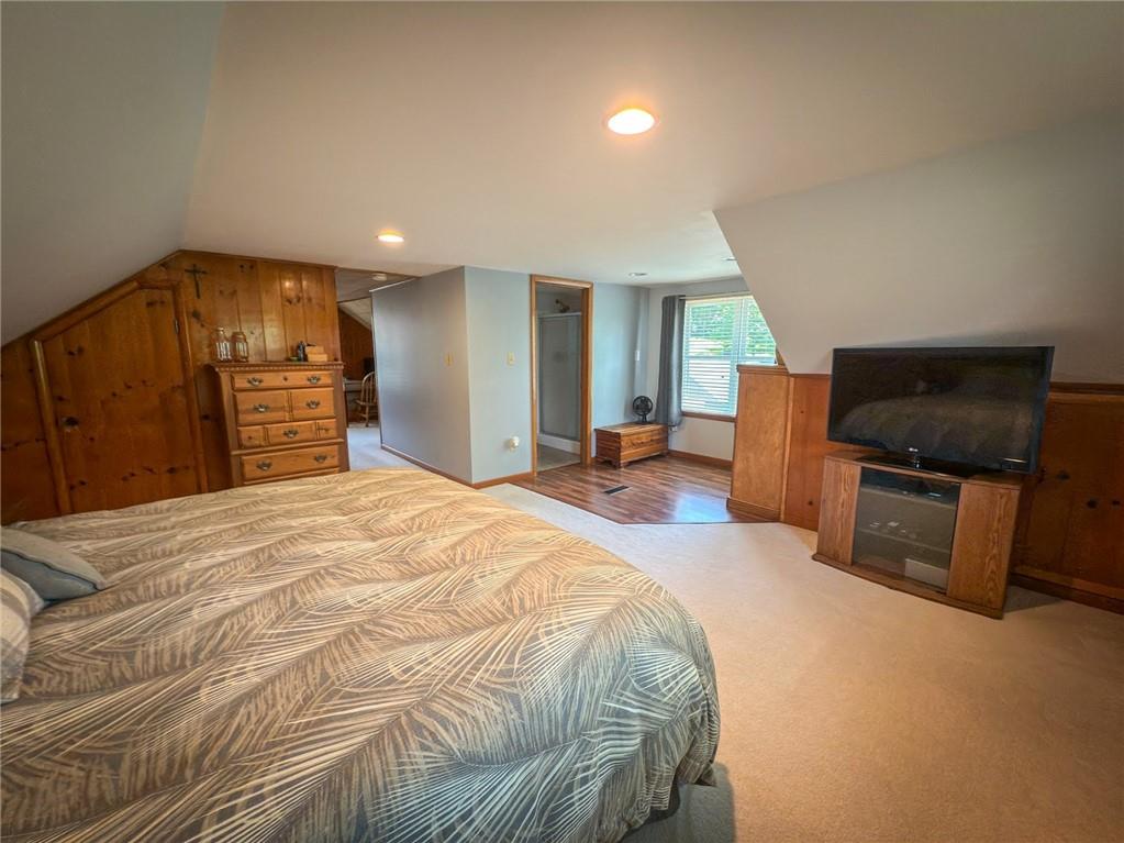 306 Chicora Road Butler, PA 16001 - Photo 21 of 30 a spacious bedroom with a bed and a television in it