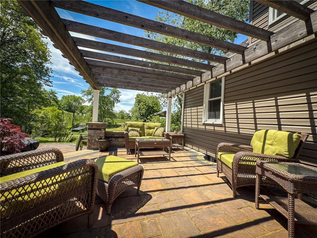 306 Chicora Road Butler, PA 16001 - Photo 23 of 30 a view of a patio with table and chairs with wooden floor and fence