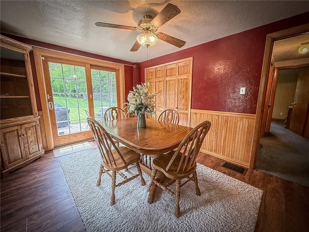 306 Chicora Road Butler, PA 16001 - Photo 6 of 30 a dining room with furniture a chandelier and wooden floor