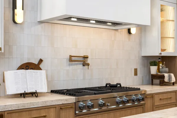 a kitchen with stainless steel appliances a stove and a refrigerator
