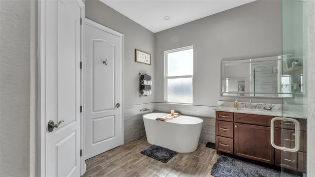 a bedroom with bed and a window