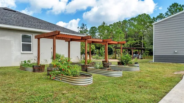 a front view of a house with a yard table and chairs