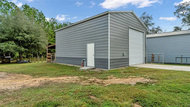 a view of a yard with an outdoor space
