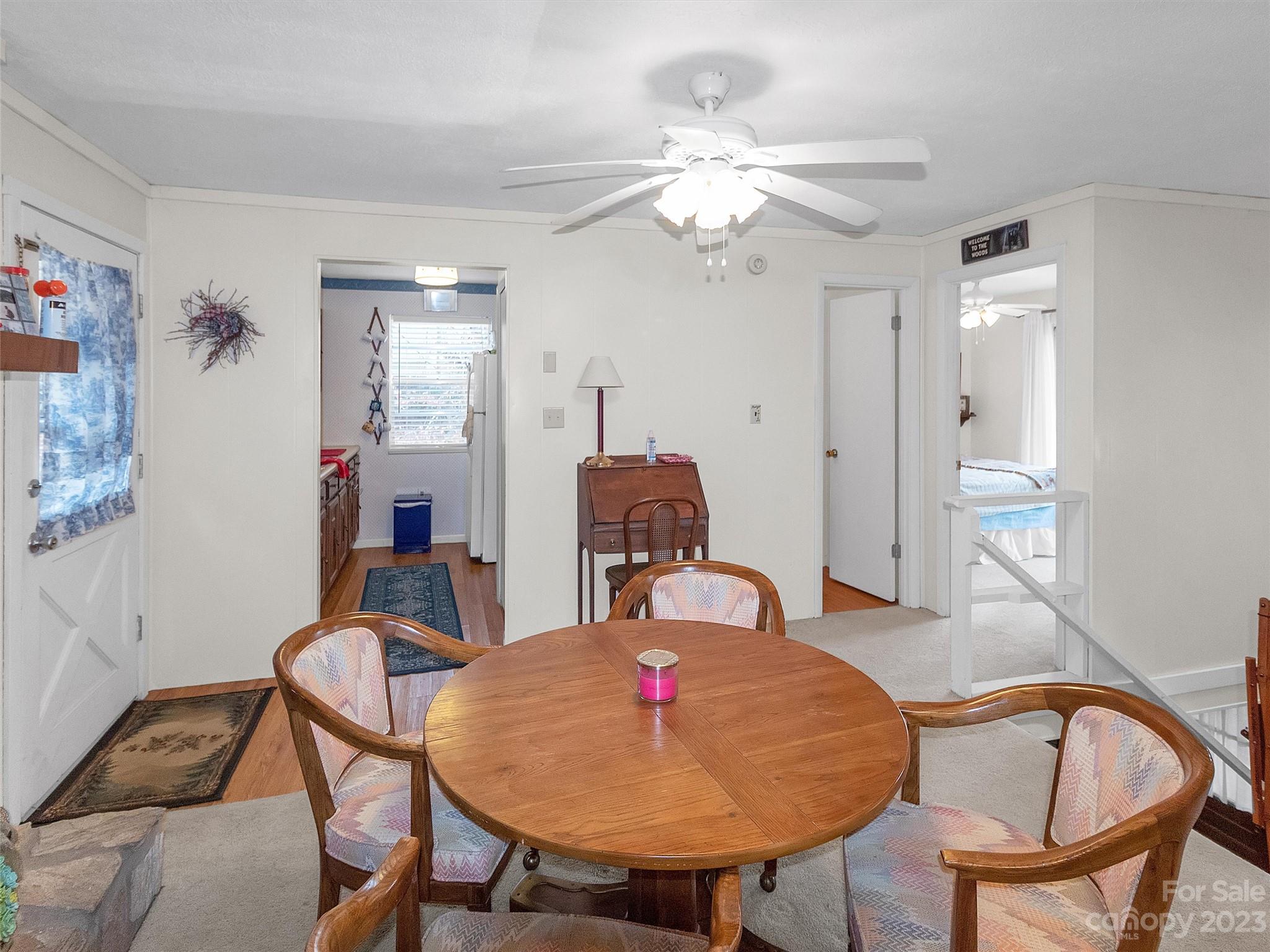 645 Mouzon Road Waynesville, NC 28785 - Photo 11 of 40 a view of a dining room with furniture and chandelier