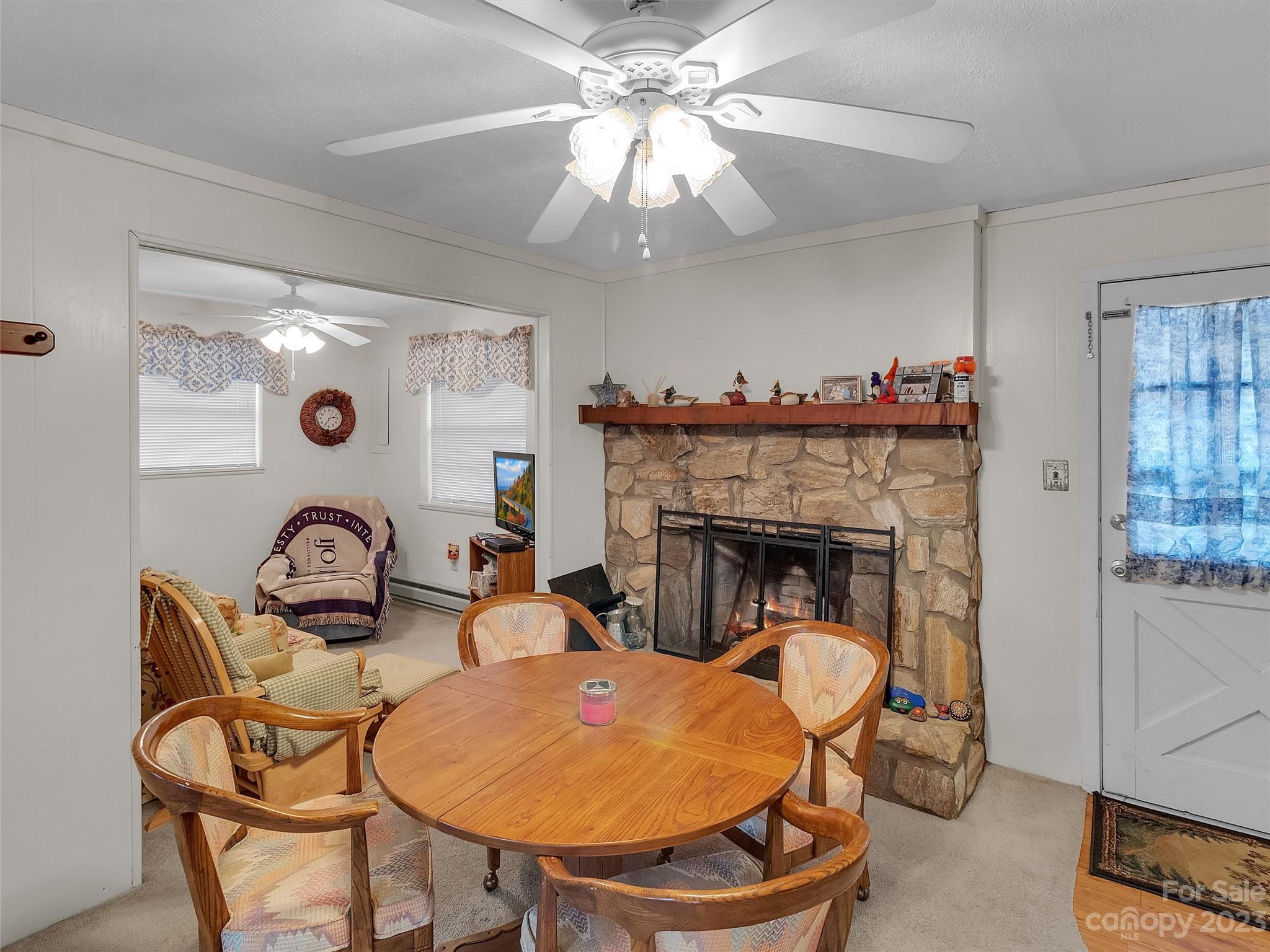 645 Mouzon Road Waynesville, NC 28785 - Photo 13 of 40 a living room with furniture and a fireplace