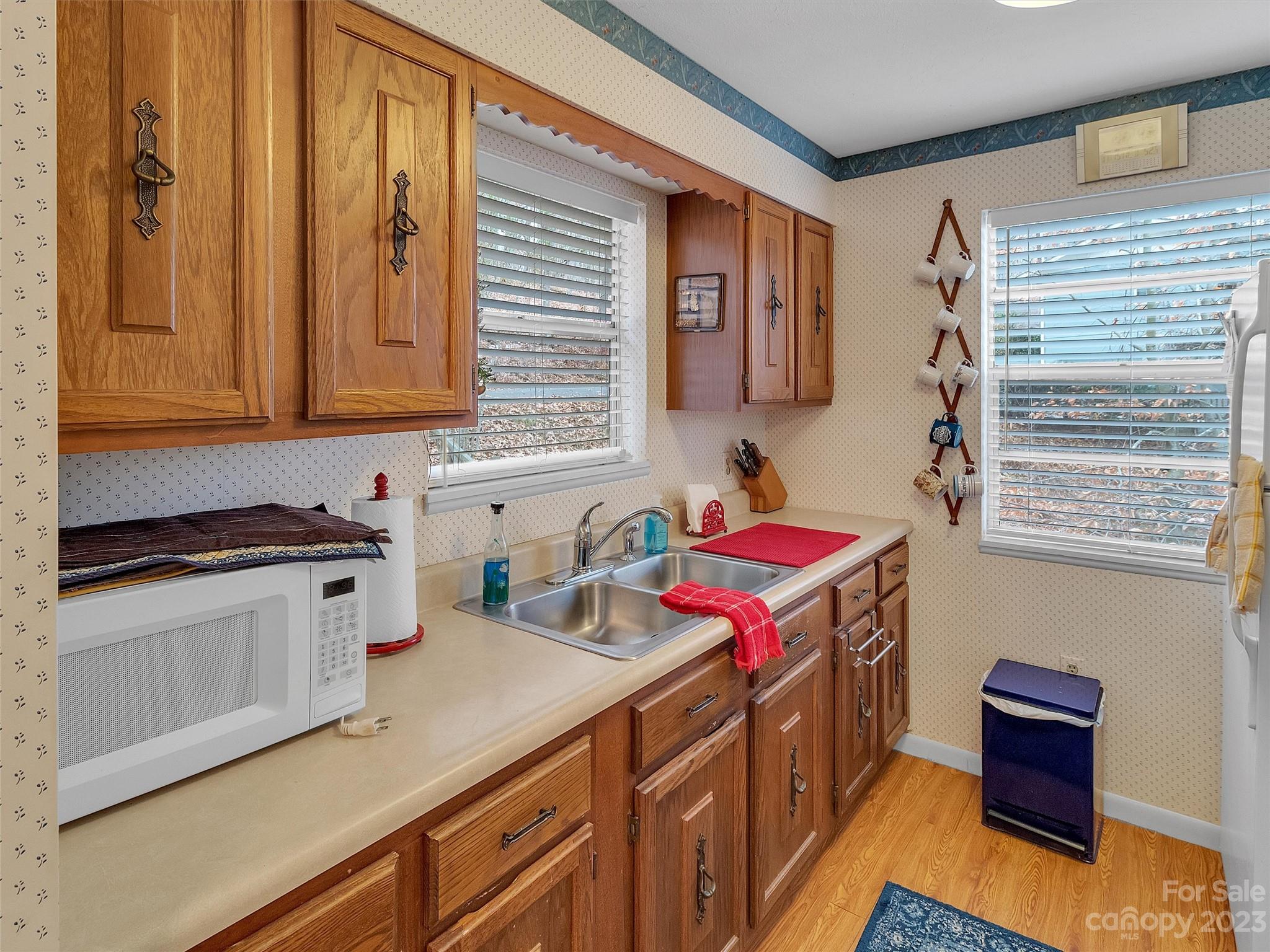 645 Mouzon Road Waynesville, NC 28785 - Photo 16 of 40 a kitchen with a stove and a sink