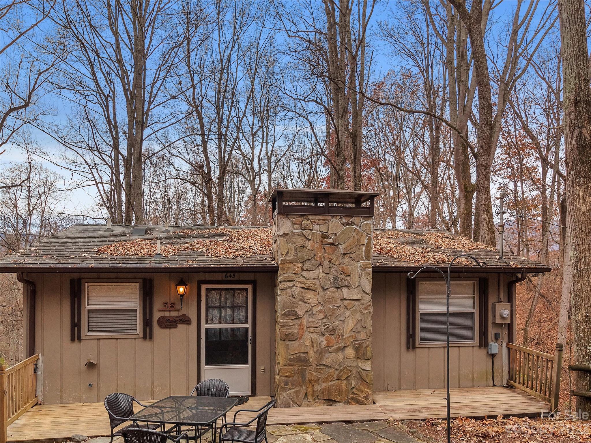 645 Mouzon Road Waynesville, NC 28785 - Photo 2 of 40 a front view of a house with garage