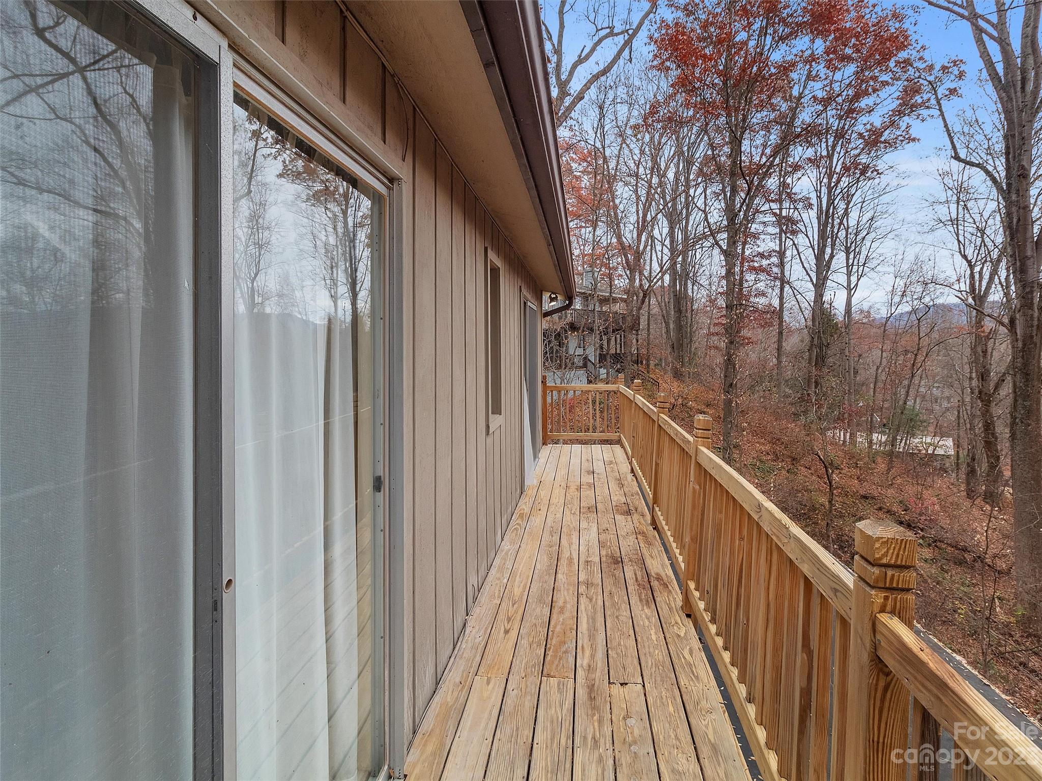645 Mouzon Road Waynesville, NC 28785 - Photo 24 of 40 a view of balcony with wooden floor and fence
