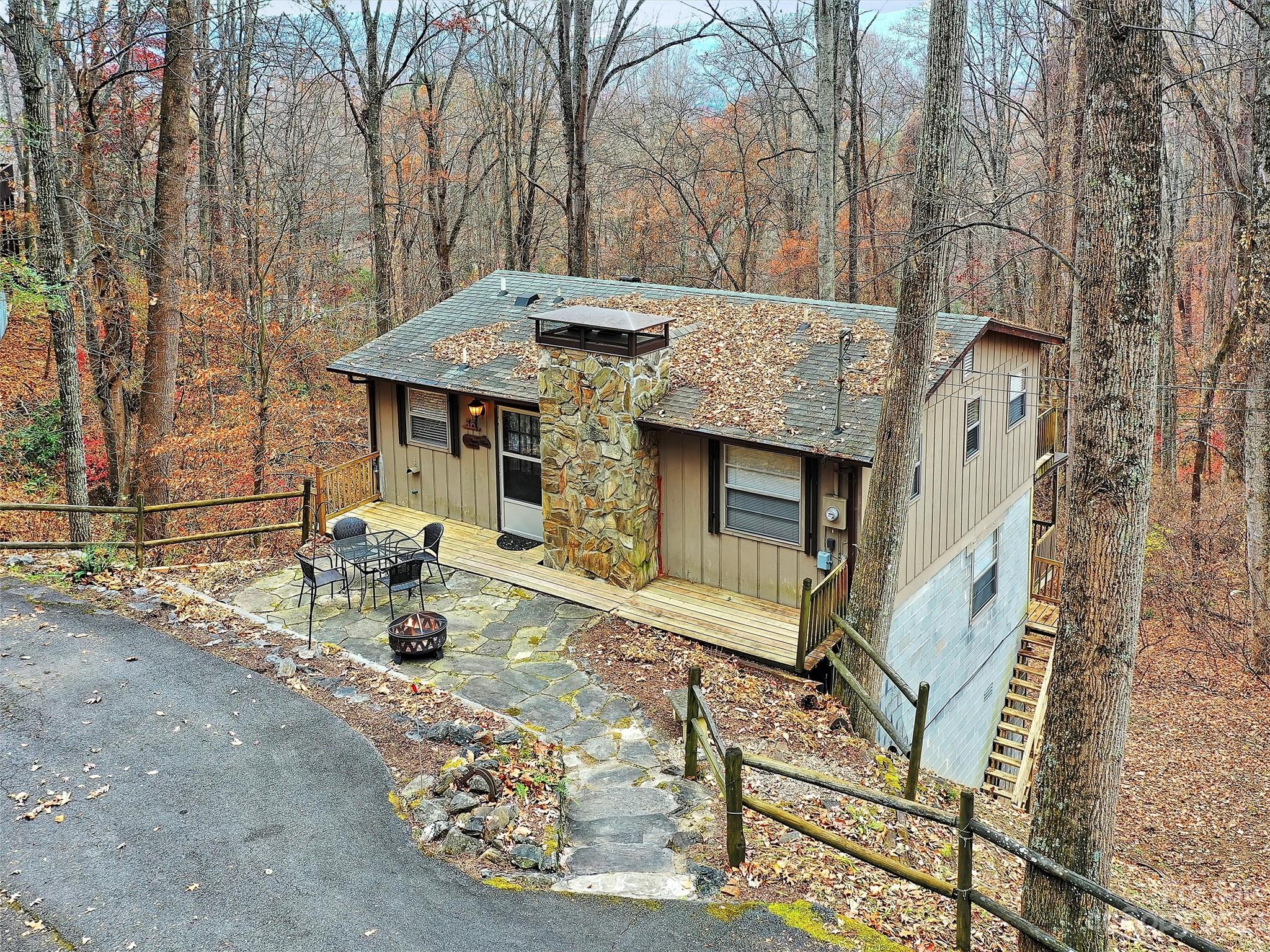 645 Mouzon Road Waynesville, NC 28785 - Photo 3 of 40 a view of a house with backyard and sitting area