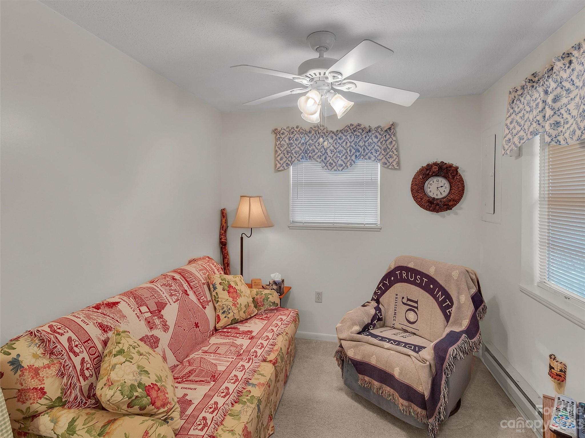 645 Mouzon Road Waynesville, NC 28785 - Photo 9 of 40 a bedroom with a bed and lamp