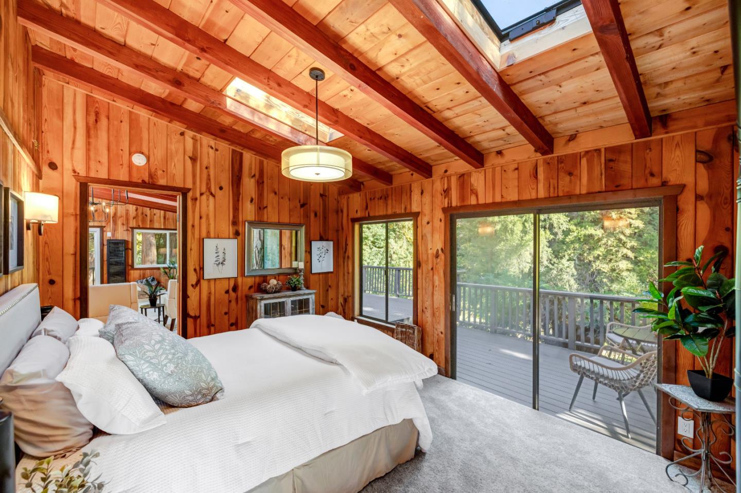 220 Lazy Woods Road Felton, CA 95018 - Photo 22 of 69 a bed sitting in a bedroom next to a large window