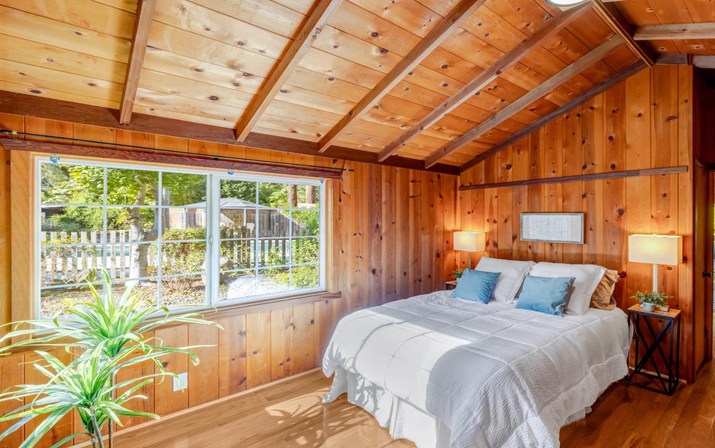 220 Lazy Woods Road Felton, CA 95018 - Photo 26 of 69 a bedroom with a bed and a large window