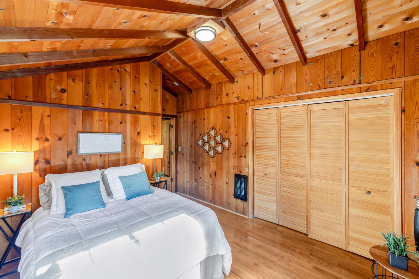 220 Lazy Woods Road Felton, CA 95018 - Photo 27 of 69 a bedroom with a bed and wooden floor