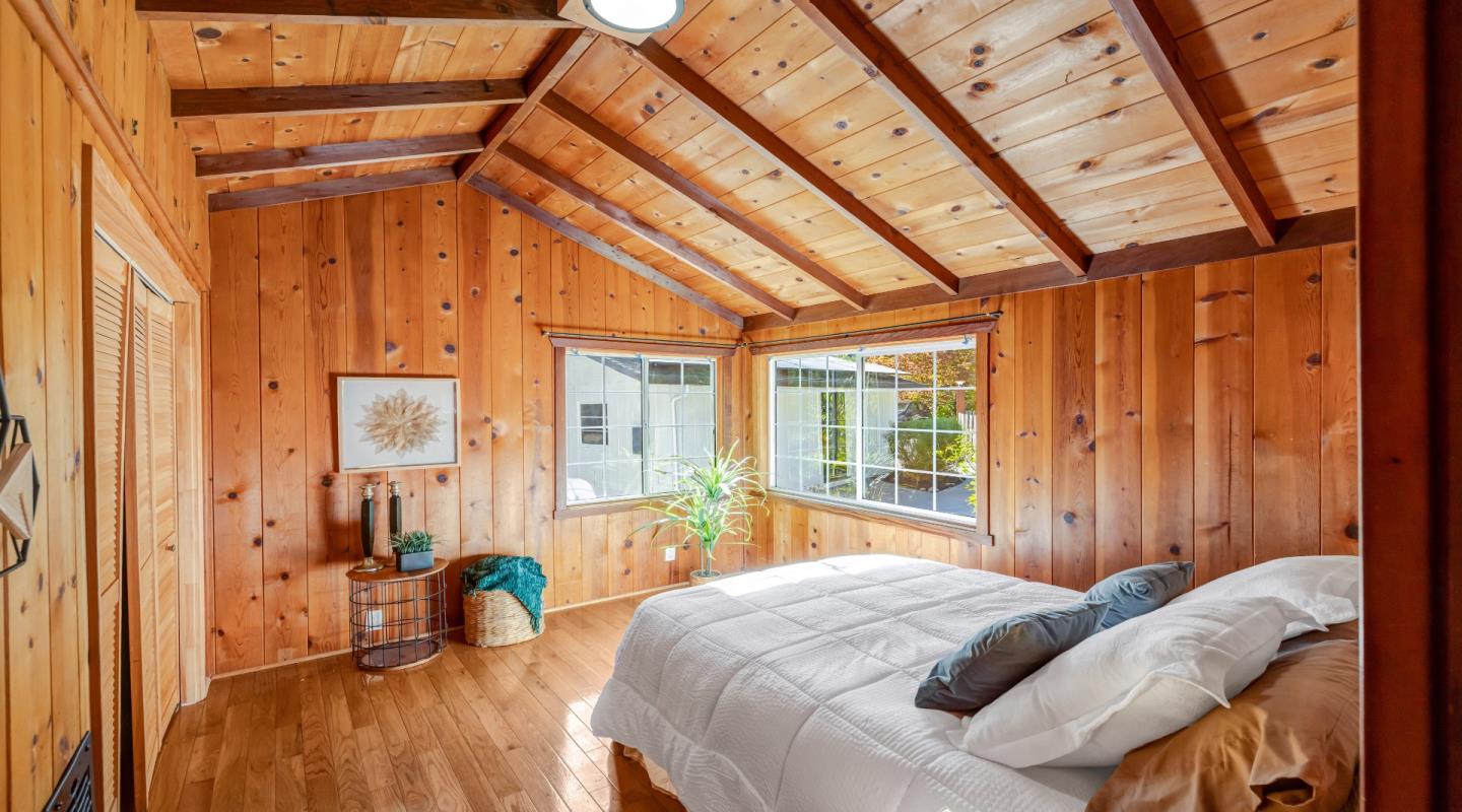 220 Lazy Woods Road Felton, CA 95018 - Photo 28 of 69 a bed sitting in a bedroom next to a window