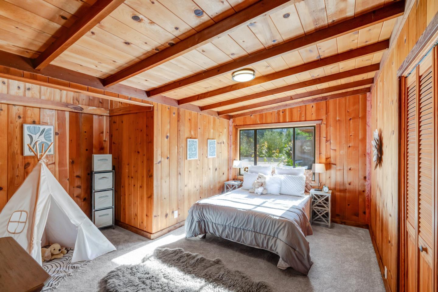 220 Lazy Woods Road Felton, CA 95018 - Photo 30 of 69 a bed sitting in a bedroom next to a window