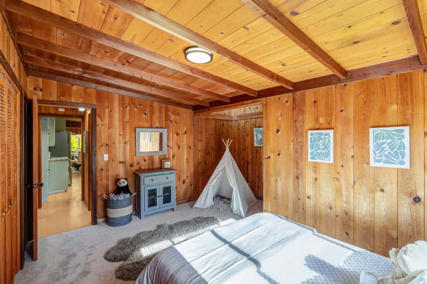 220 Lazy Woods Road Felton, CA 95018 - Photo 31 of 69 a bed room with a bed and a wooden floor