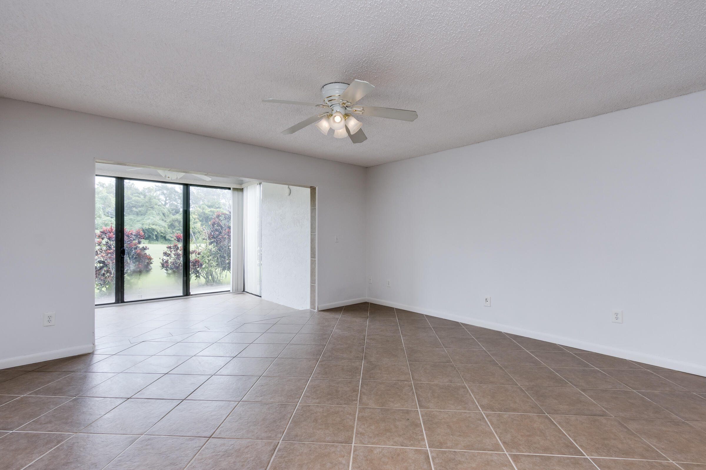 8535 Casa Del Lago, Unit 37E Boca Raton, FL 33433 - Photo 15 of 39 a view of an empty room with a window