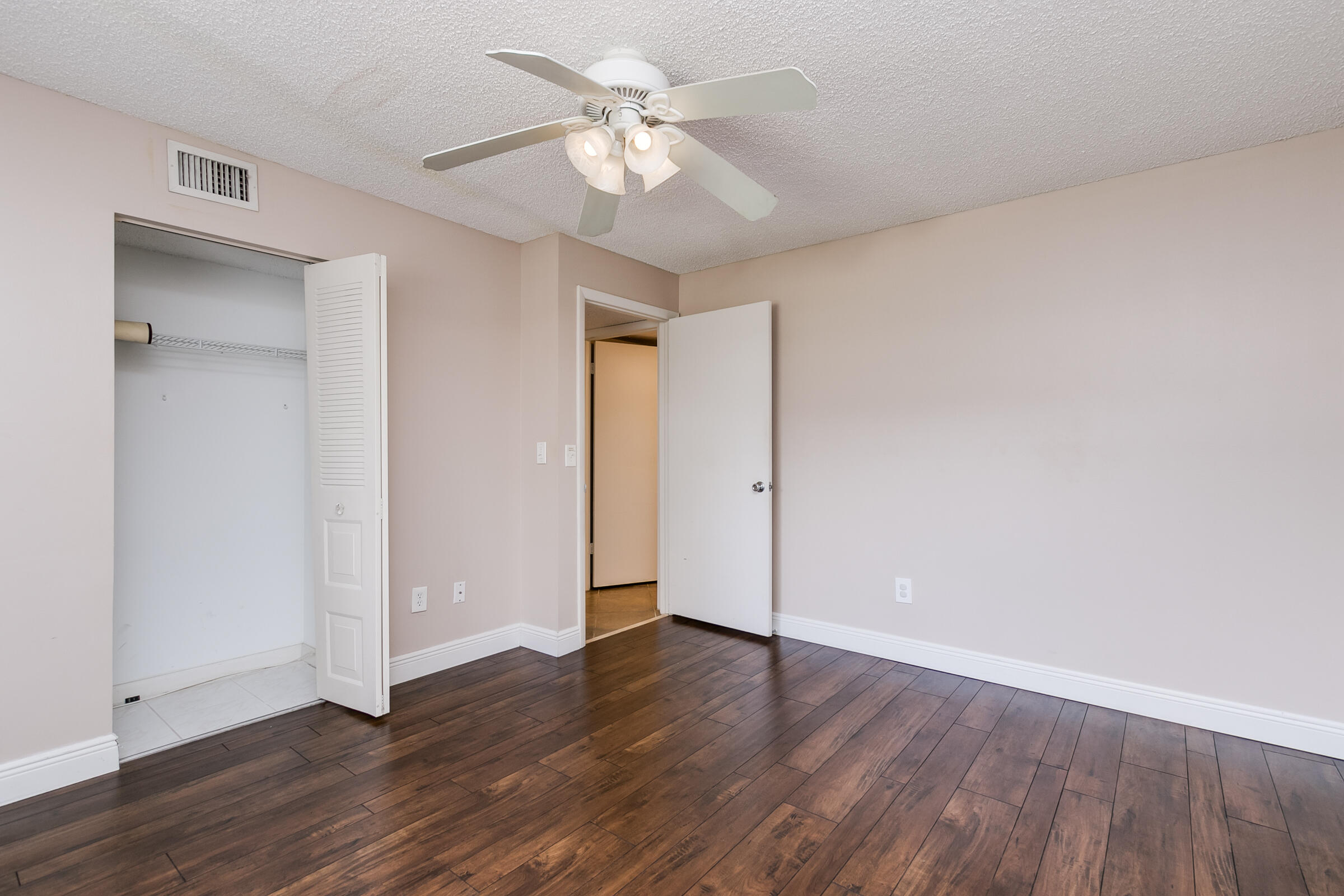 8535 Casa Del Lago, Unit 37E Boca Raton, FL 33433 - Photo 16 of 39 a view of an empty room with wooden floor