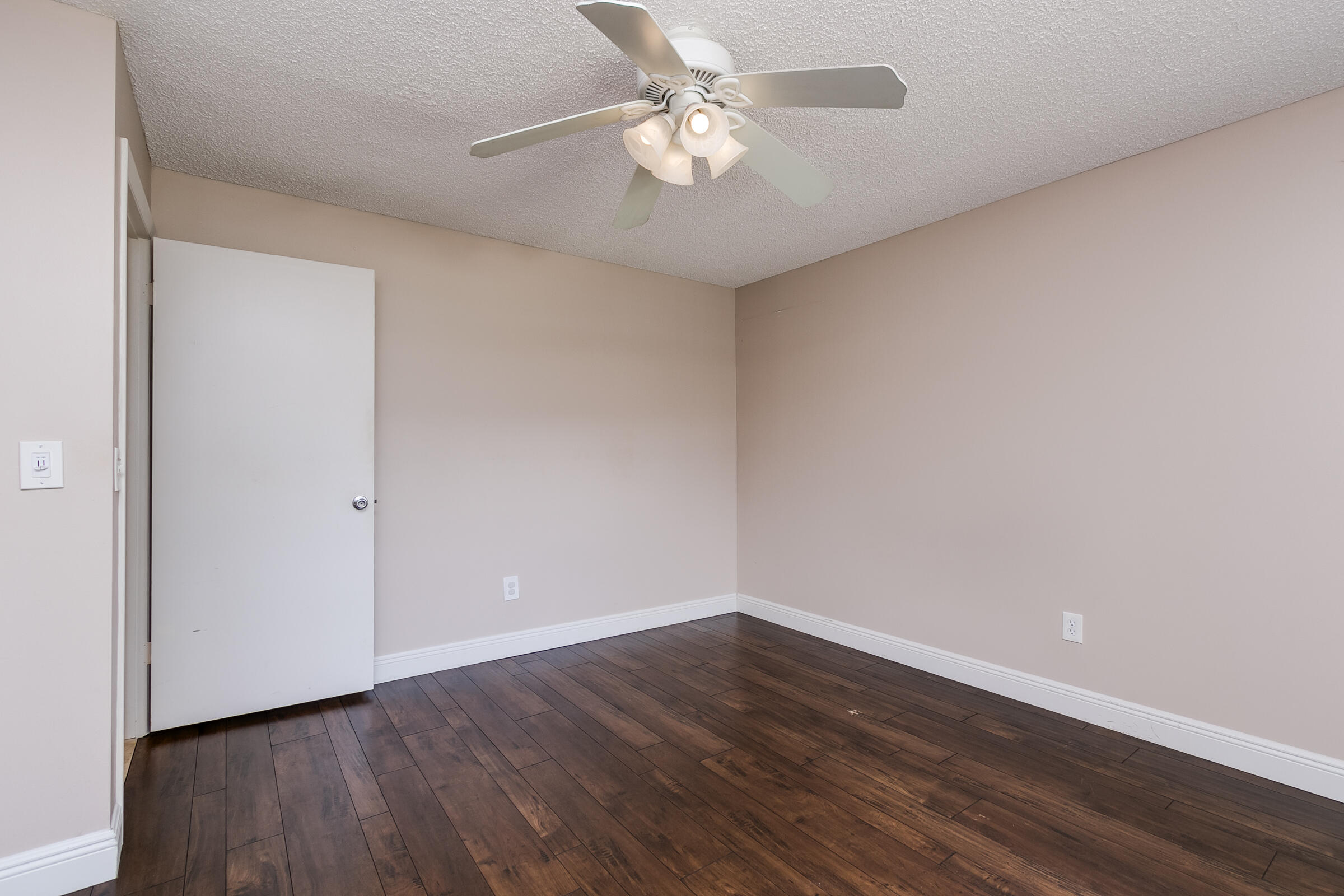 8535 Casa Del Lago, Unit 37E Boca Raton, FL 33433 - Photo 18 of 39 a view of an empty room with wooden floor