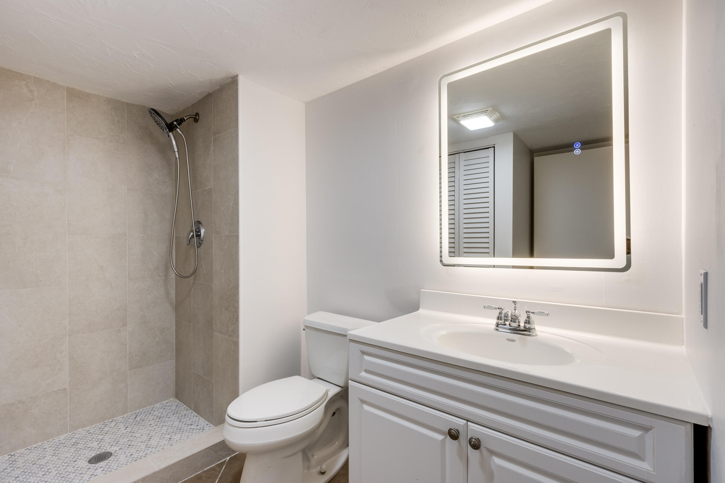 8535 Casa Del Lago, Unit 37E Boca Raton, FL 33433 - Photo 20 of 39 a bathroom with a sink toilet and shower