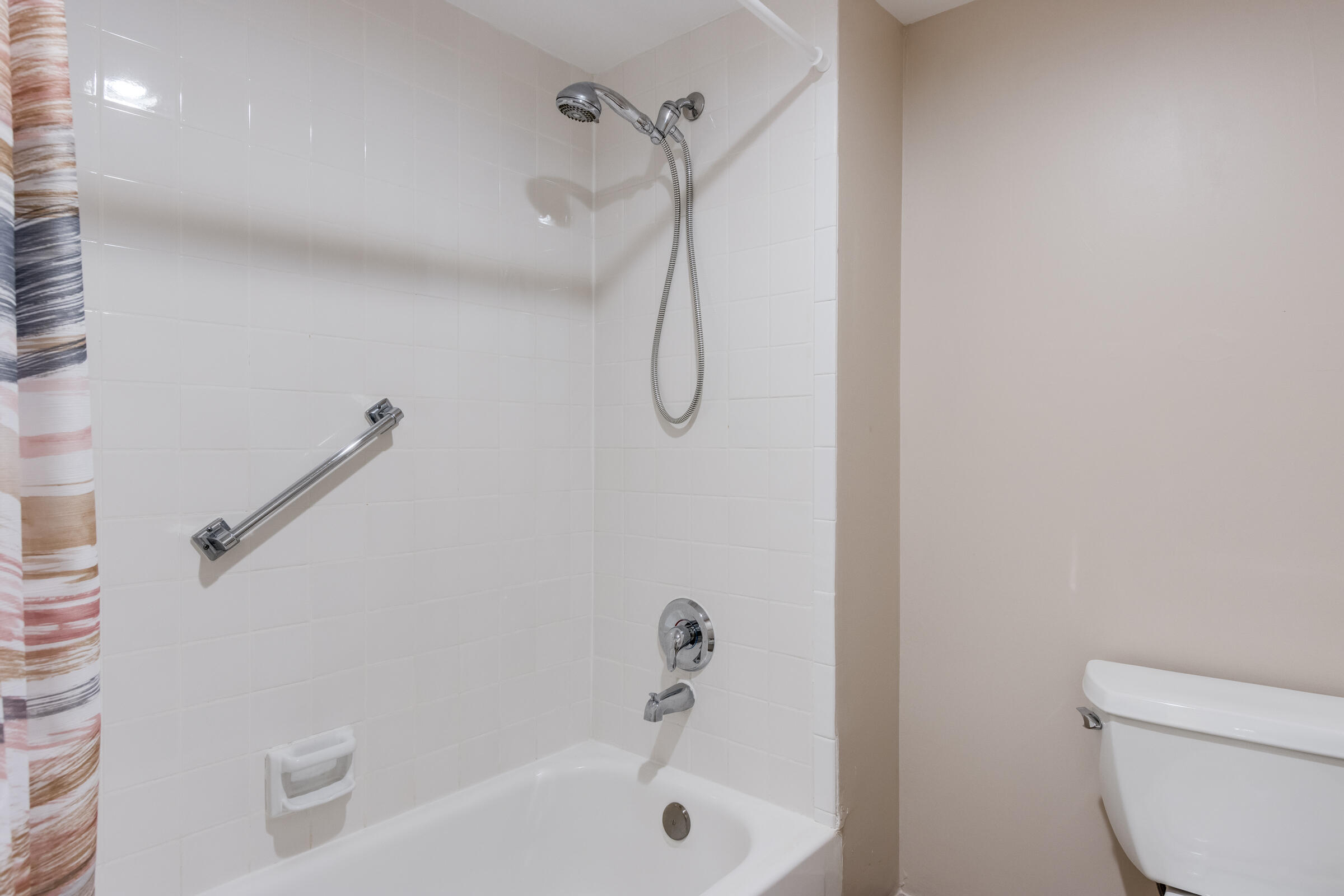 8535 Casa Del Lago, Unit 37E Boca Raton, FL 33433 - Photo 28 of 39 a bathroom with a shower and a toilet