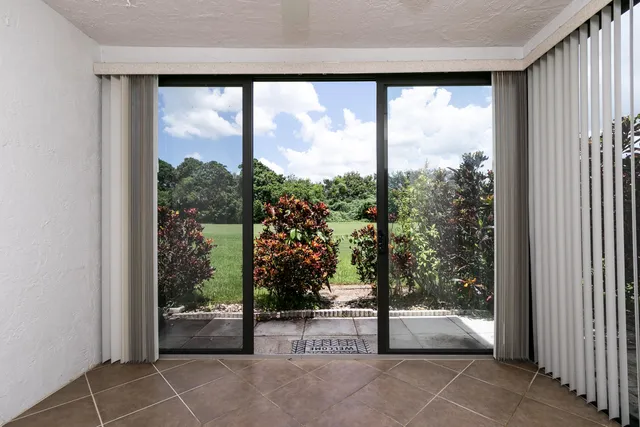 a view of a room with sliding glass door and mountain view
