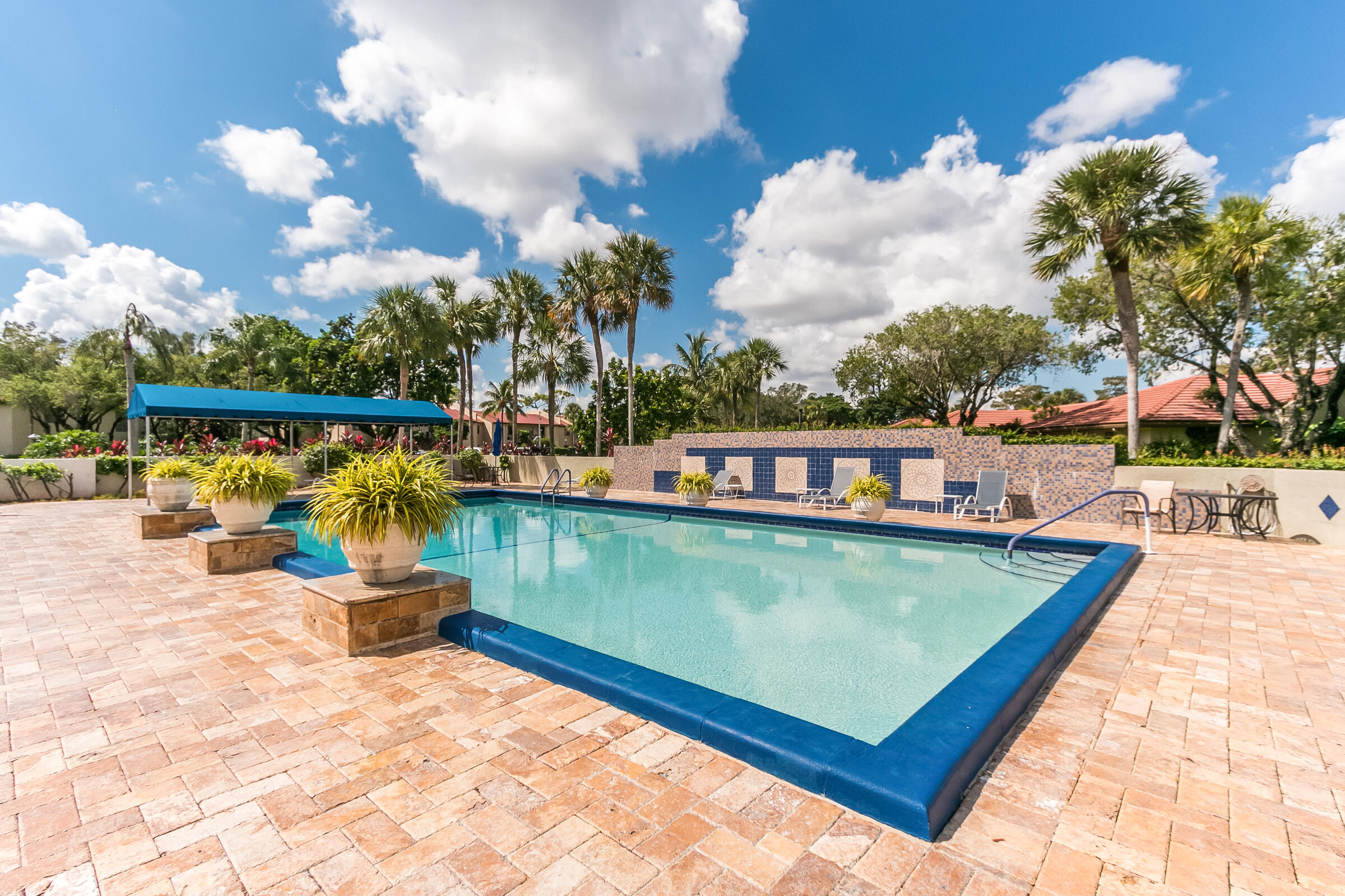 8535 Casa Del Lago, Unit 37E Boca Raton, FL 33433 - Photo 38 of 39 swimming pool with outdoor seating