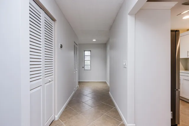 a view of a hallway with windows
