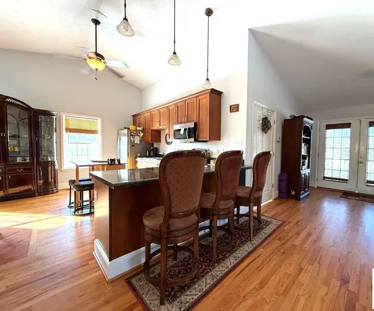 a view of a dining room with furniture and wooden floor